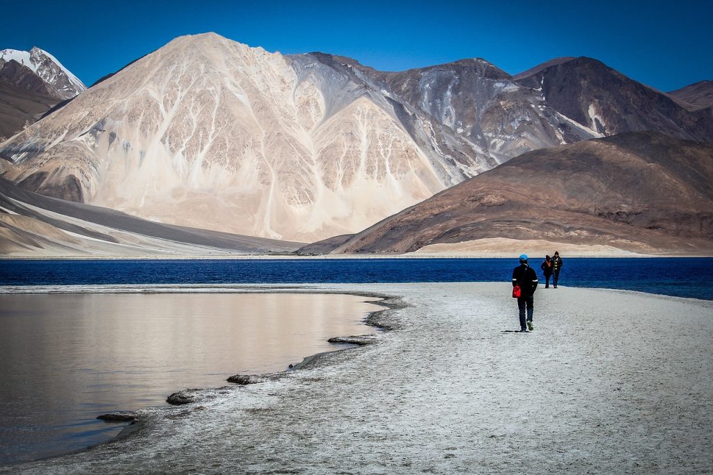 Scenic views of a lake in Ladakh with crystal clear water and radiant sky.