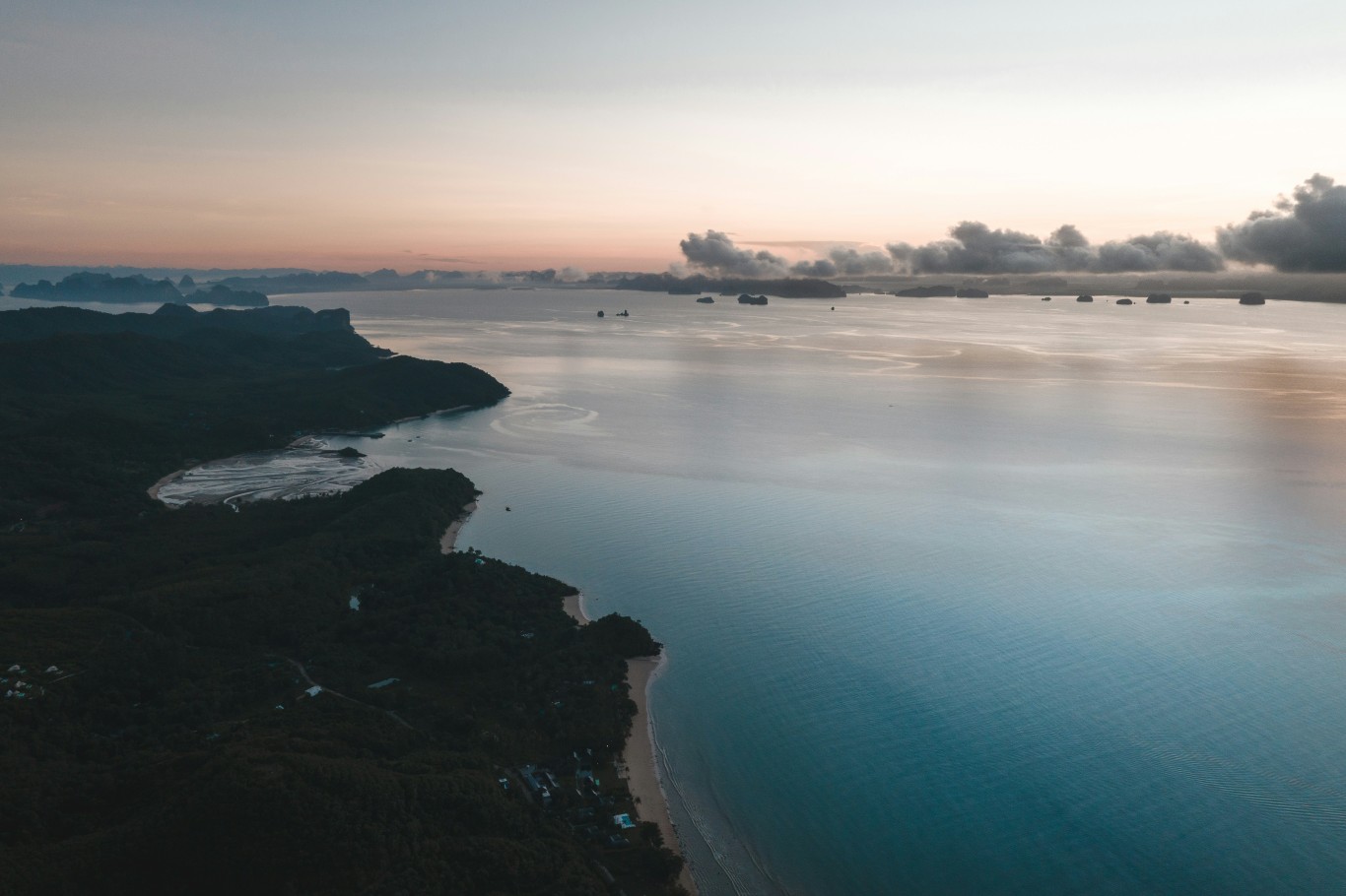 Peaceful morning view of Koh Yao Noi’s coastline, with turquoise waters and lush greenery