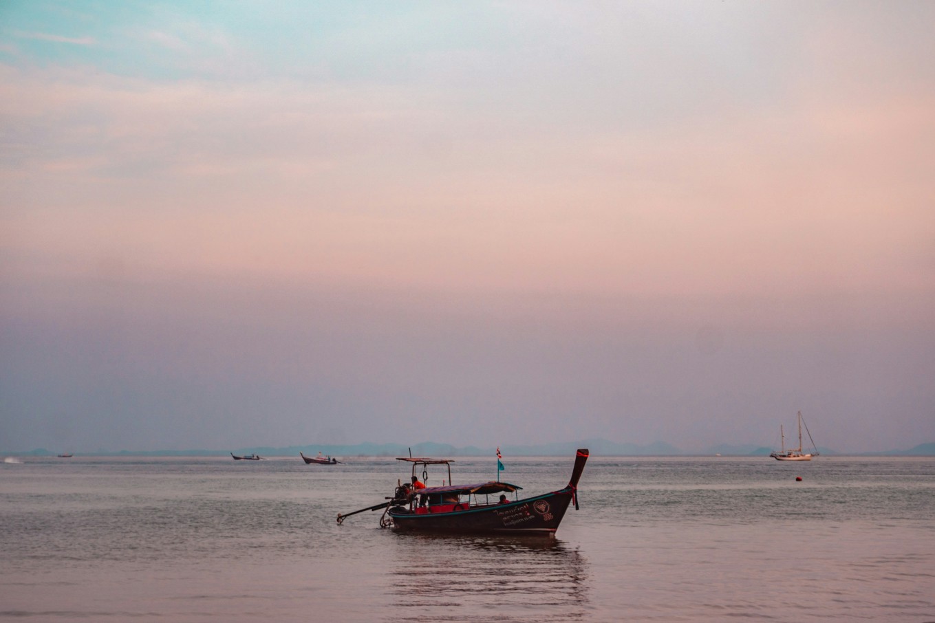 A traditional Thai boat floating off Koh Yao Noi’s coast.