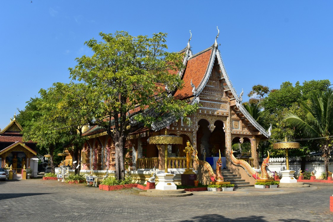 Golden-roofed temple in Chiang Mai showcasing traditional Thai architecture.