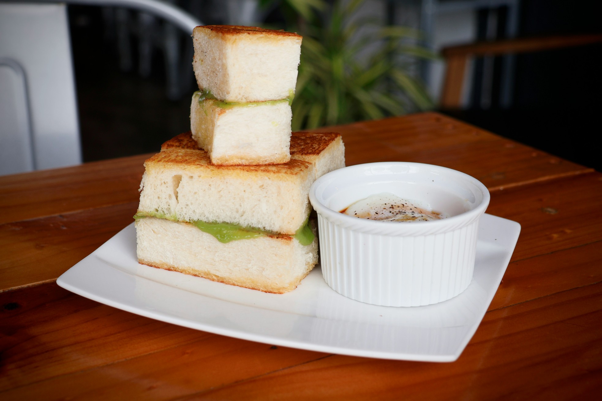 Milk loaf spread with Malaysian pandan kaya served with half-boiled eggs 