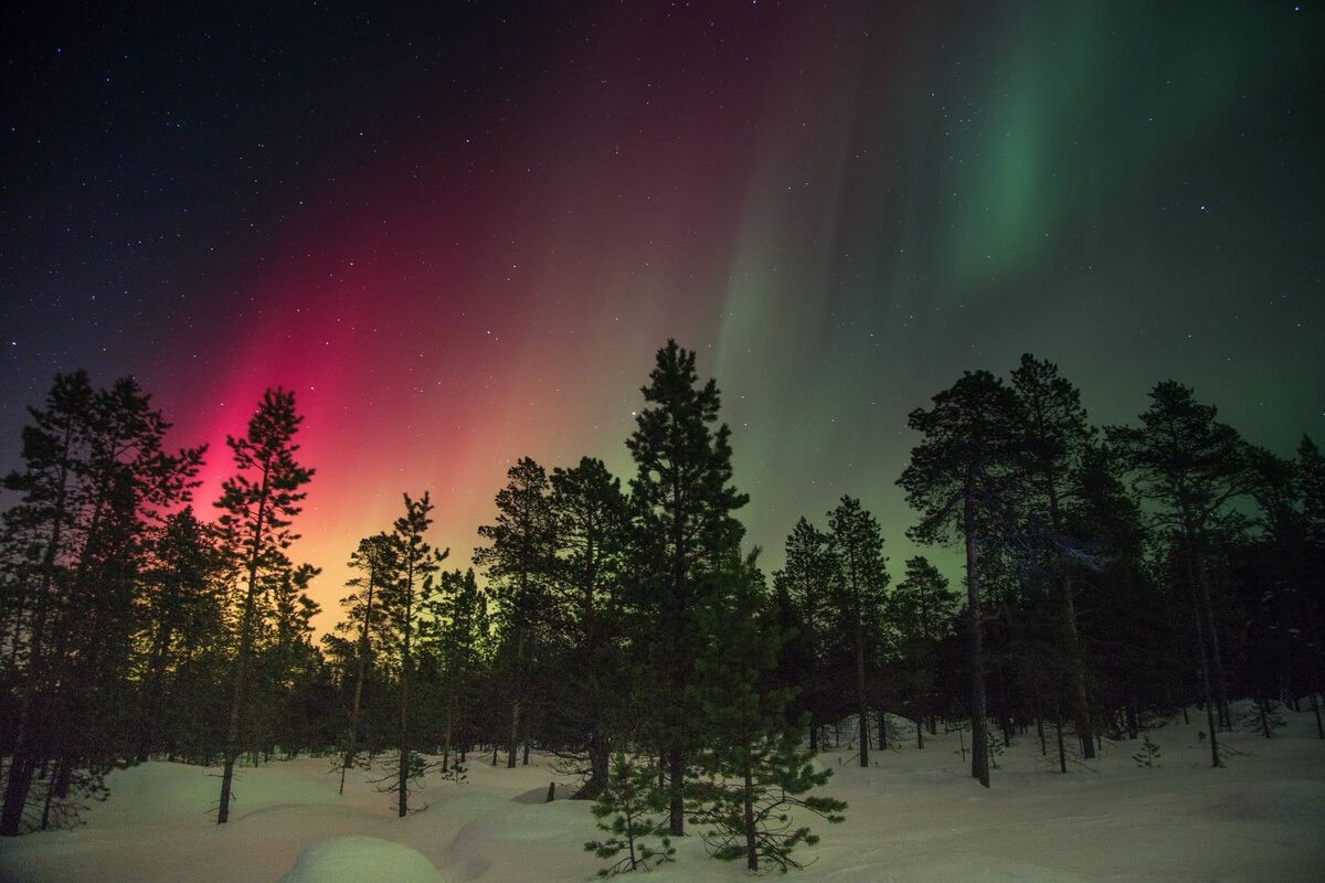 Northern Lights over the winter landscape of Abisko, Sweden